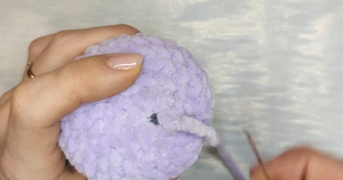 Close-up of Baylie the Bunny amigurumi face with safety eyes and plastic safety nose.