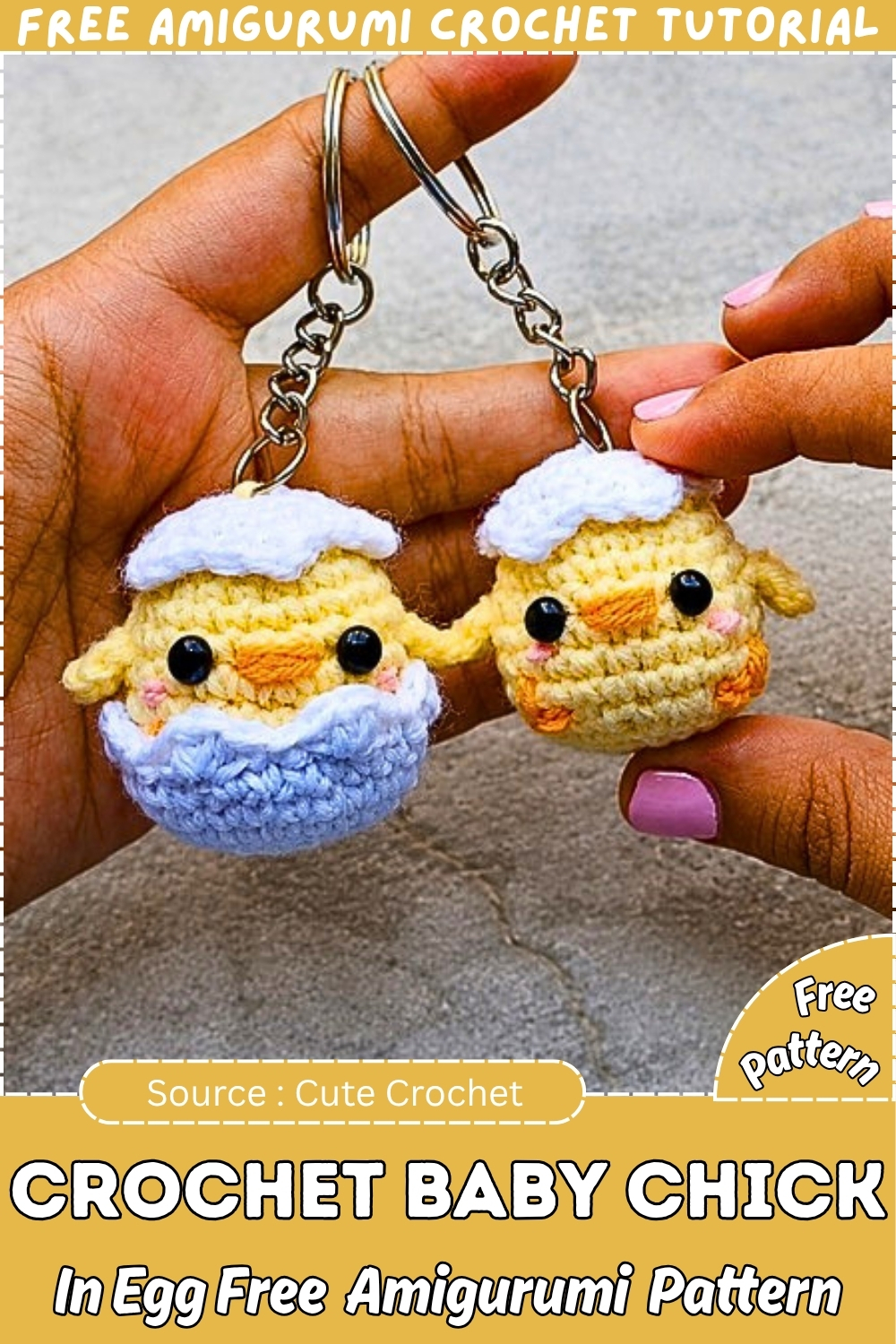 Two crochet baby chick amigurumi keychains held up outdoors one inside a cracked blue egg and one standalone both in yellow with white eggshell hats orange beaks and silver chain keyrings