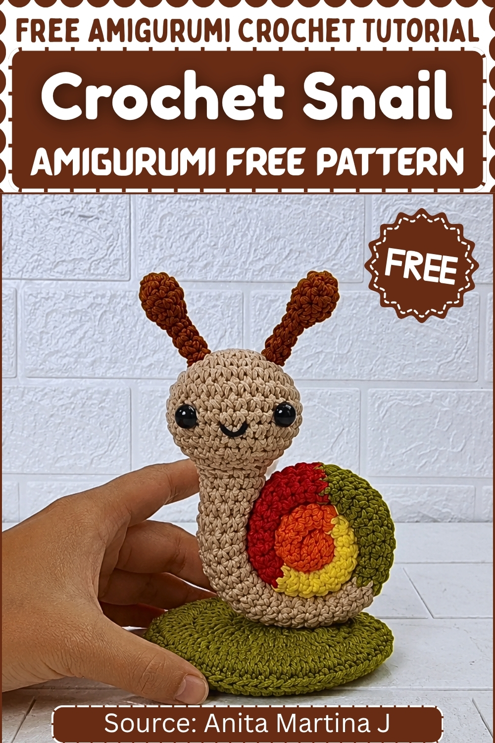 Completed crochet snail amigurumi held in a hand showing the full body, shell, and spiral color detail, with pattern title text overlay.